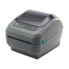 Zebra GK420d thermal label printer, compact black device with paper roll, used for printing barcode and shipping labels.